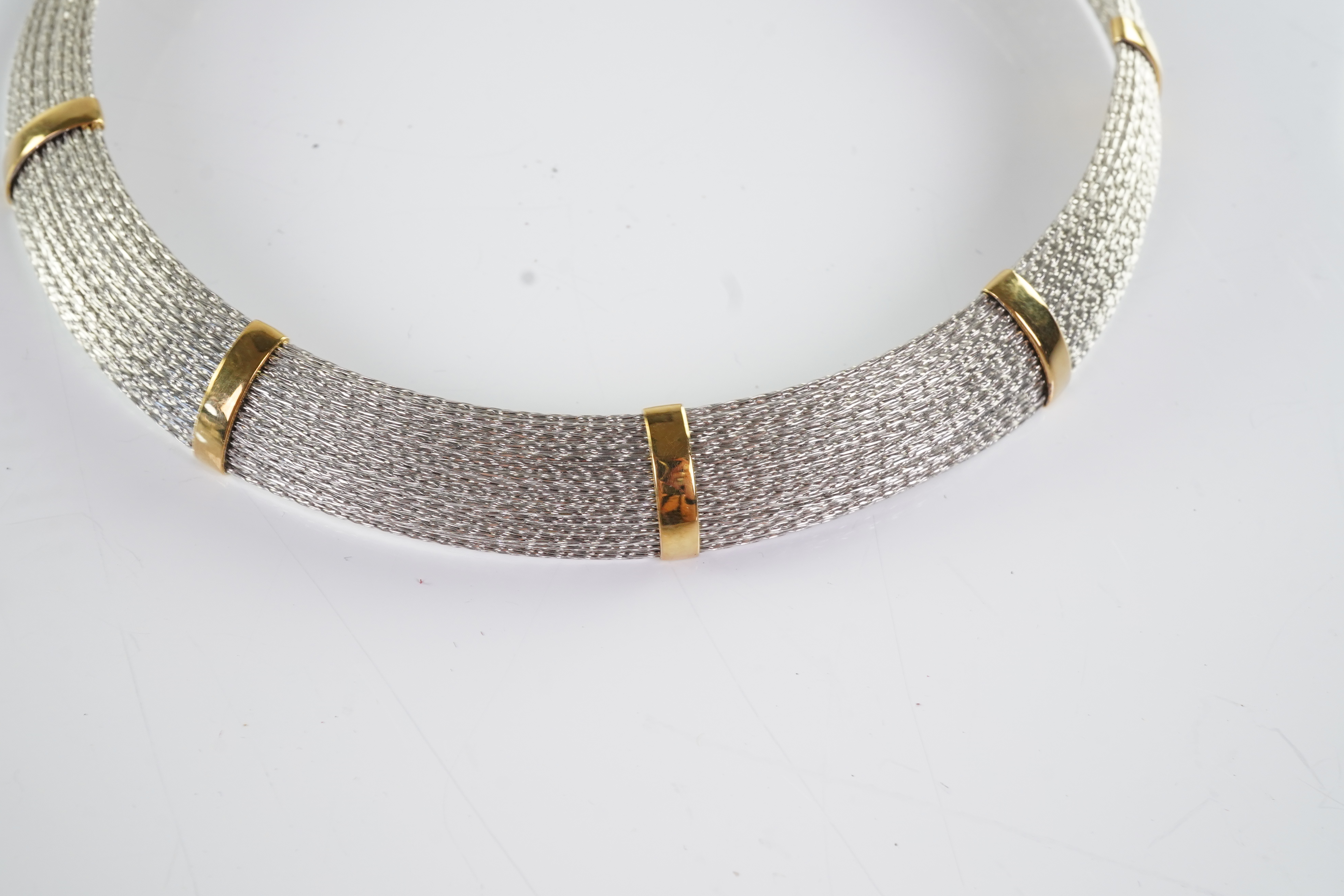 An 18ct gold collar and bangle